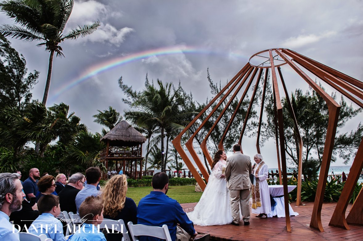 Destination wedding scene with rainbow shot by Cincinnati photographer Daniel Michael
