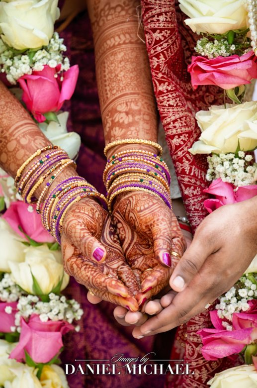Elaborate henna designs on bride's hands at Indian wedding ceremony