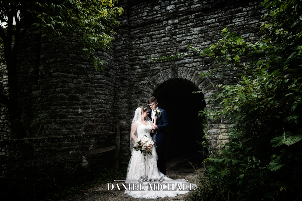 Couple in front of stone tunnel
