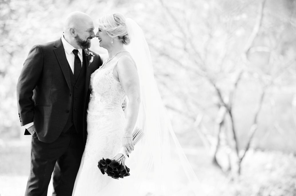 Couple hugging with black and white filter overlay