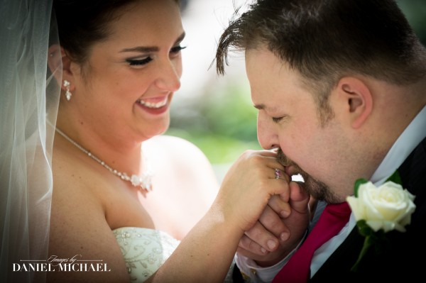 Man kissing woman's hand