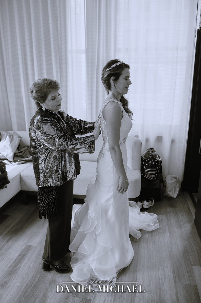 Mom Helping Bride into Wedding Dress